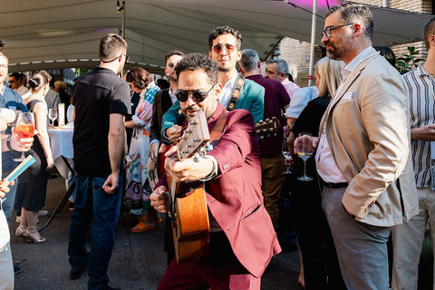Musicians performing at sunset event